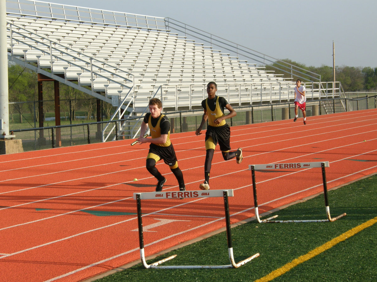 Image: Justin and Devonta — Justin Hayes and Devonta Simmons practice their hand off.