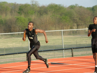 Image: John Isaac sticks it — John Isaac digs deep.