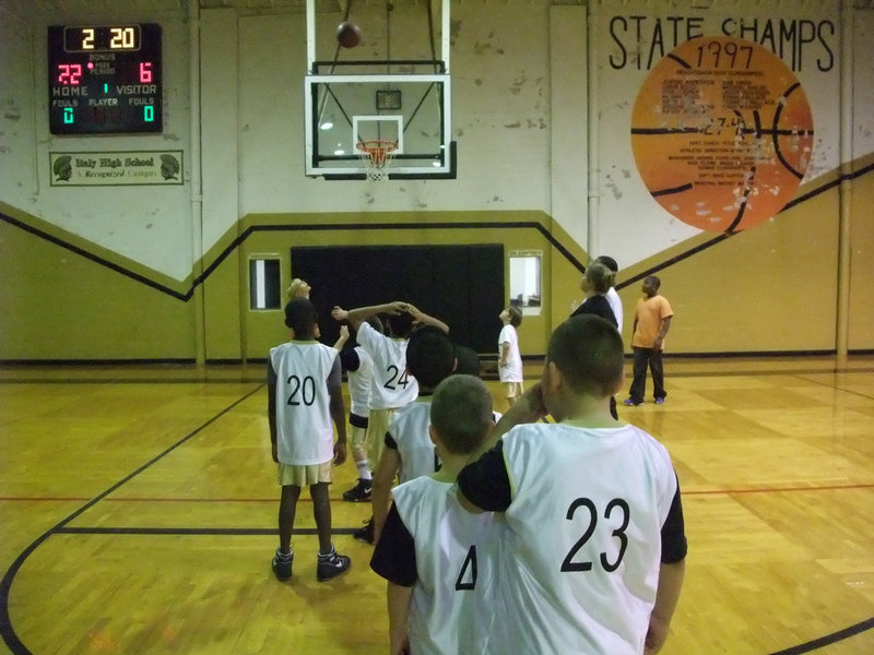 Image: From the line — Coach Misty Escamilla’s 3rd &amp; 4th Grade boys practice free throws at the break.