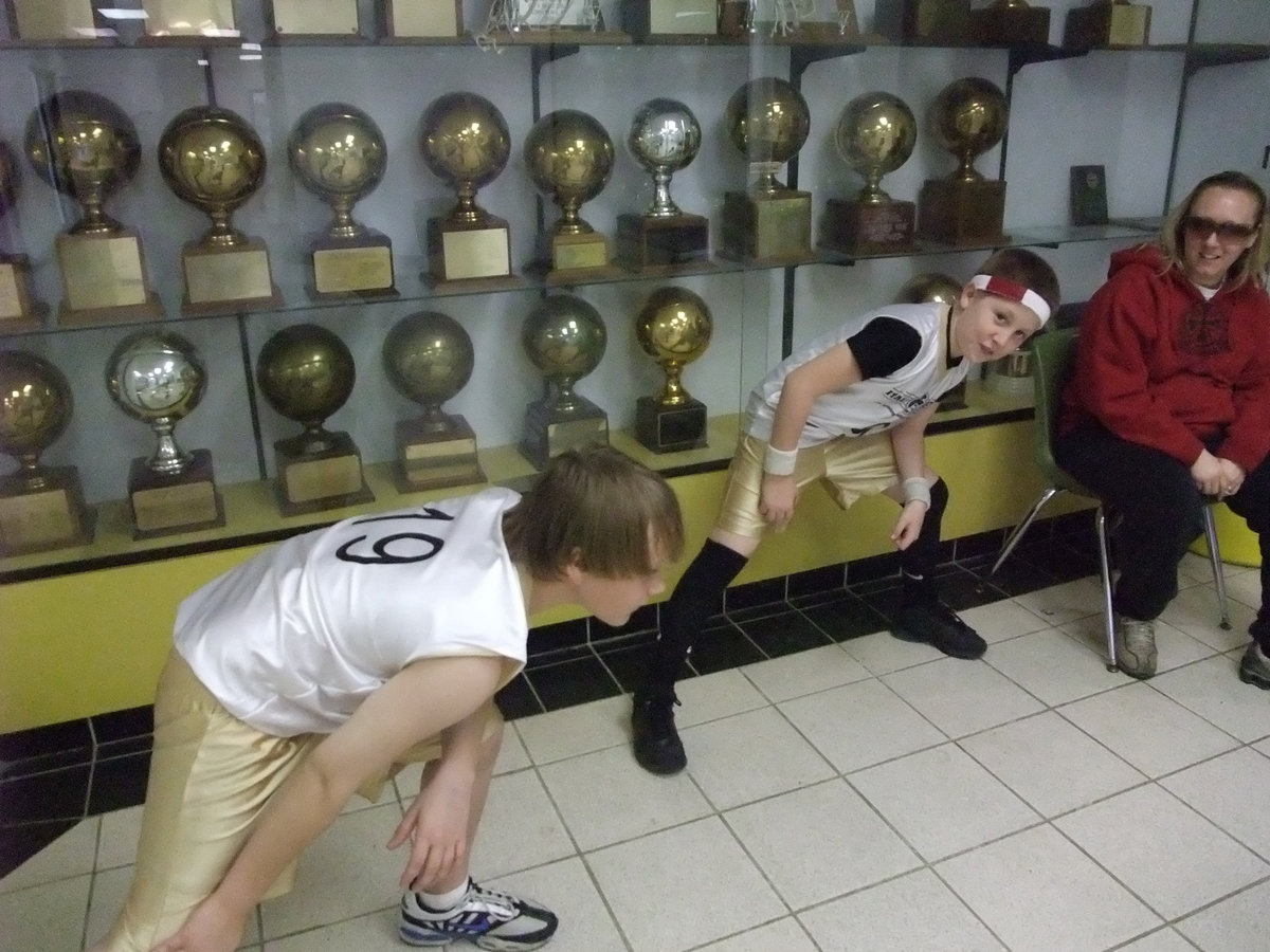 Image: Getting loose — Lance and J.T. stretch it out before their game against Hillsboro Maroon. The stretching worked as Italy had to come from behind in the 4th period to win.