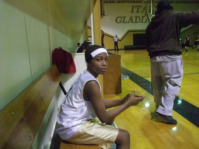Image: Tony Wilson — Tony Wilson cheers on his teammates while he catches his breath.