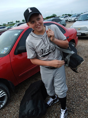 Image: Bailey Walton — First Baseman Bailey Walton carried the equipment to the field and later blooped a double over Whitney’s infield to help tie the game 8-8.
