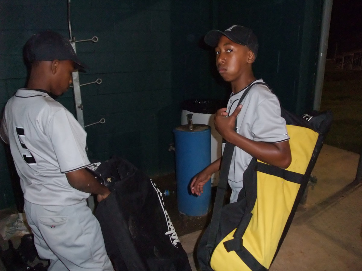 Image: Eric and Jacob — Bagging up after the game is Eric Carson and Jacob Essery.