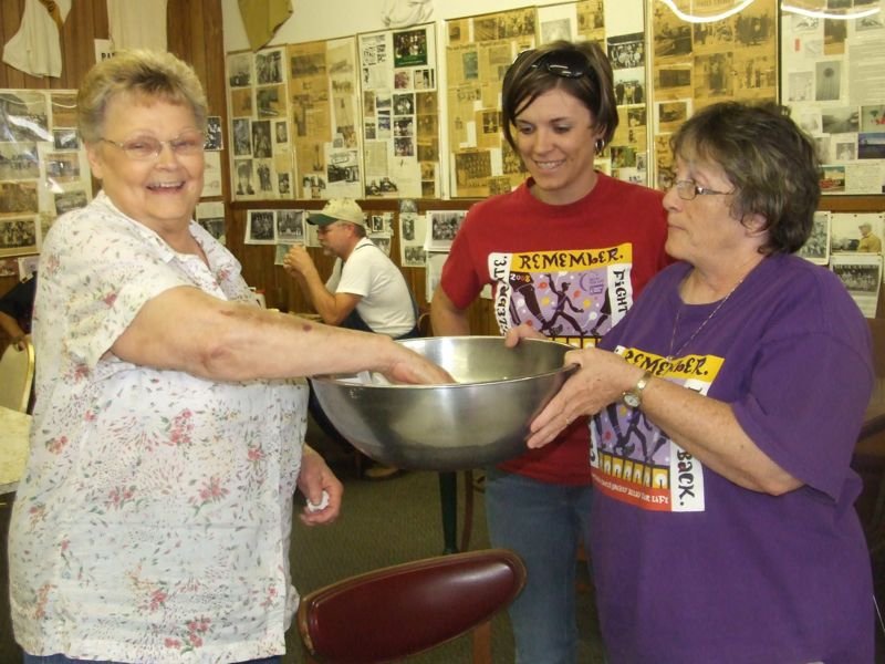 Image: And the winner is … — Doris Mitchell pulling out the lucky prize winner ticket along with Jenna Chambers and Karen Mathiowetz.