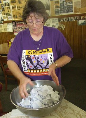 Image: Mix the tickets — Karen Mathiowetz stirring up the raffle tickets for the big drawing.