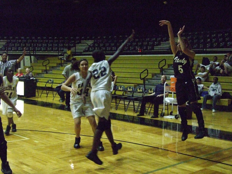 Image: DeMoss delivers — DeMoss releases a 3-pointer against the Lady Eagles.