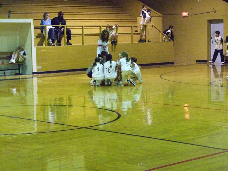Image: Haight & Holden Huddle — Talking it over is Italy 14 head coach Tina Haight, Assistant Coach Casey Holden and “Haight’s Hoopsters.”