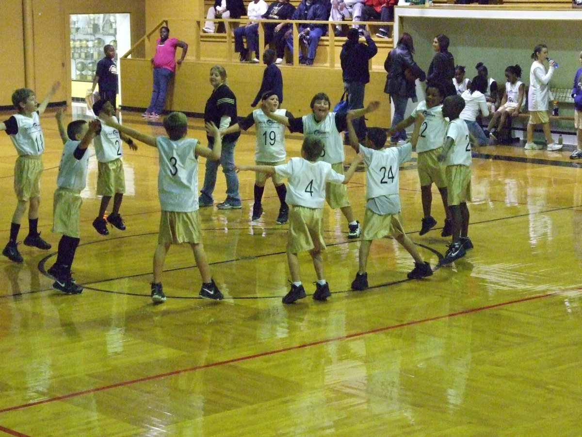Image: Jumping For Joy — Italy 19 celebrates their team’s victory in the center circle with jumping jacks.
