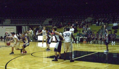 Image: Reed Jacinto — Jacinto dribbles around a Red Oak defender.