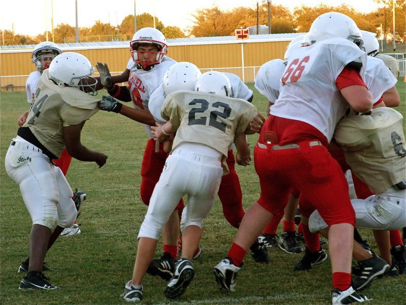 Image: Game on the line — Italy’s linebacker Cody Boyd(22) tries to keep Axtell’s Dillon McBride from crossing the goal line but the Longhorns get the 2-point conversion and tie the Junior High Gladiators 22-22 at Willis Field in Italy.