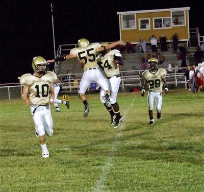 Image: Good times — Chase Hamilton(10), Zackery Boykin(55), Adrian Reed(64) and Eric Carson(28) are overjoyed after Italy’s exciting win over the Axtell Longhorns.