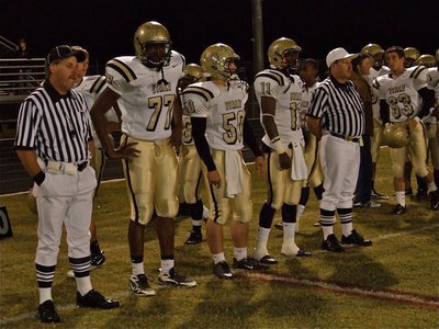 Image: The Captains — Italy’s Larry Mayberry(77), Ethan Simon(50) and Jasenio Anderson(11) are ready to represent the Gladiators at midfield for the coin toss.