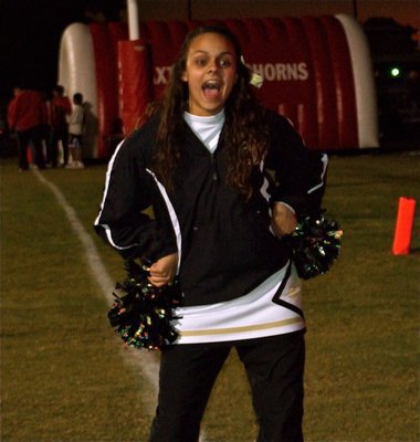 Image: Go, Anna, go! — IHS Cheerleader Anna Viers gets her groove on before the game.