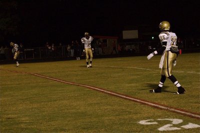 Image: Ready to run — Gladiators De’Andre Sephus(20), Heath Clemons(2) and Corrin Frazier(25) await the game’s opening kickoff.