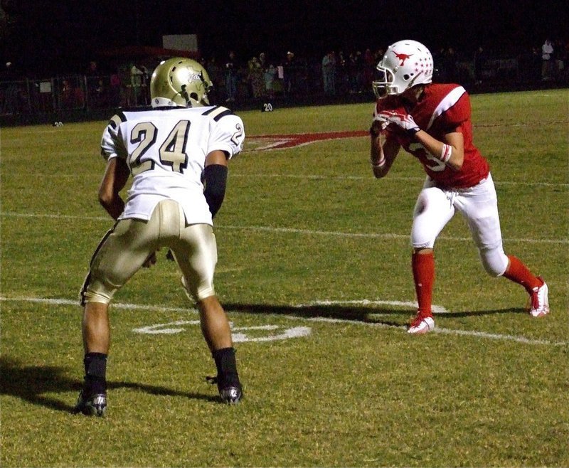Image: Troy in coverage — The newest Gladiator, Troy Scott(24), matches up with Longhorn receiver Randal Outlaw(3).