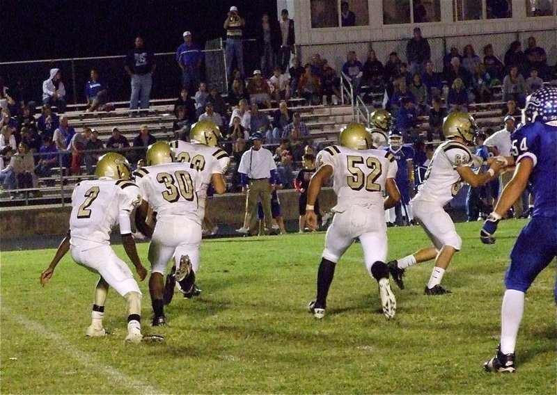 Image: Heath Clemons keeps the Gladiators on track against Lions — Italy’s Heath Clemons(2) steps in at quarterback for the Gladiators after Jasenio Anderson and a fellow teammate took an early exit from the game after an on-field altercation with the Blooming Grove Lions. Clemons received help from his comrades in holding off the Lions 48-34. Above, Clemons hands to Jalarnce Jamal Lewis(30) who follows Kyle Jackson(28), Jacob Lopez(52), Brandon Souder(63) and Devonta Simmons(9) downfield.