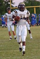 Image: Jasenio gets ready — Jasenio Anderson(11) put in a solid effort with 82-yards rushing and 165-yards passing in a quarter and a half.