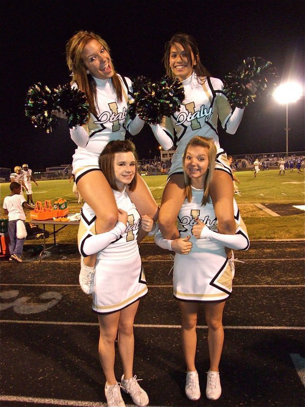Image: Fab four — IHS Cheerleaders Morgan Cockerham, Beverly Barnhart, Meagan Hooker and Sierra Harris carry the team on their shoulders.