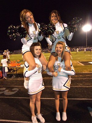 Image: Fab four — IHS Cheerleaders Morgan Cockerham, Beverly Barnhart, Meagan Hooker and Sierra Harris carry the team on their shoulders.