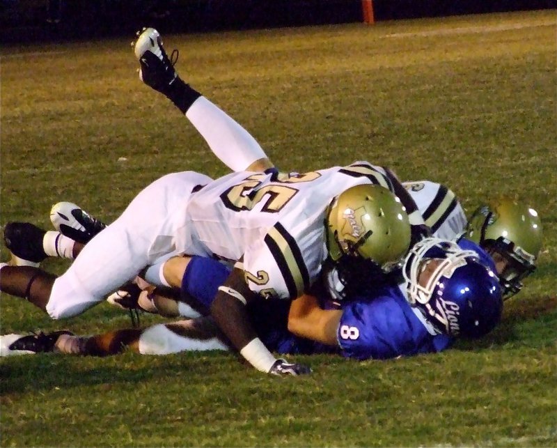 Image: Two for one — Corrin Frazier(25) and Jase Holden(6) duo tackle Lions’ receiver Jacob Conger(8).
