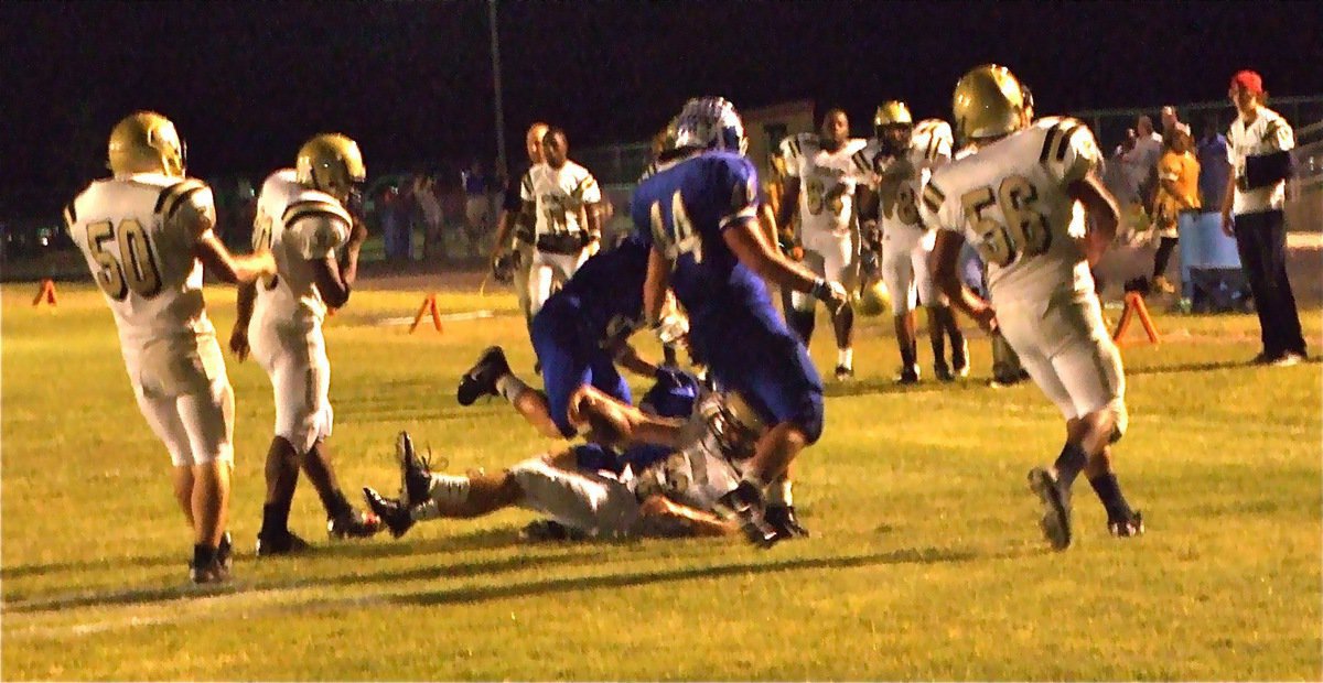 Image: Living the dream — Gladiator offensive lineman Brandon Souder(63) takes an offensive pitch from quarterback Heath Clemons and did his best to get in the endzone. Clemons mentioned later, “I thought I was pitching to Kyle Jackson but when I realized Souder caught it, I just yelled, ‘Run!’”