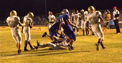Image: Living the dream — Gladiator offensive lineman Brandon Souder(63) takes an offensive pitch from quarterback Heath Clemons and did his best to get in the endzone. Clemons mentioned later, “I thought I was pitching to Kyle Jackson but when I realized Souder caught it, I just yelled, ‘Run!’”