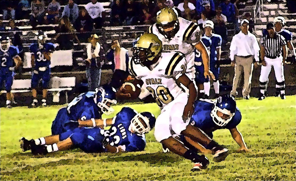 Image: Lewis is elusive — Italy’s Jalarnce Jamal Lewis(30) gets a block from Ethan Simon(50) and heads upfield against the Lions.