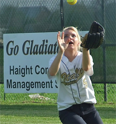 Image: I got it! — Sierra Harris calls for the catch.