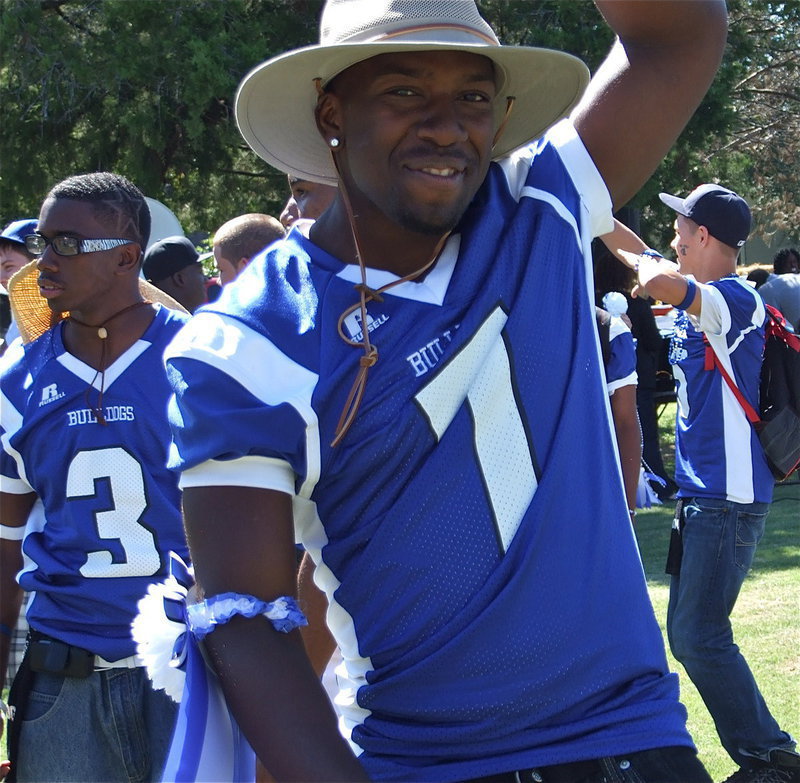 Image: Here come the ‘Dawgs’ — Jamie Johnson(7), Jamaar Davis(3) and Eric Evans have fun during the pep rally earlier in the day.