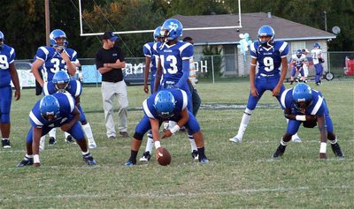 Image: Practice time — Milford’s offense takes a few practice snaps before the game.