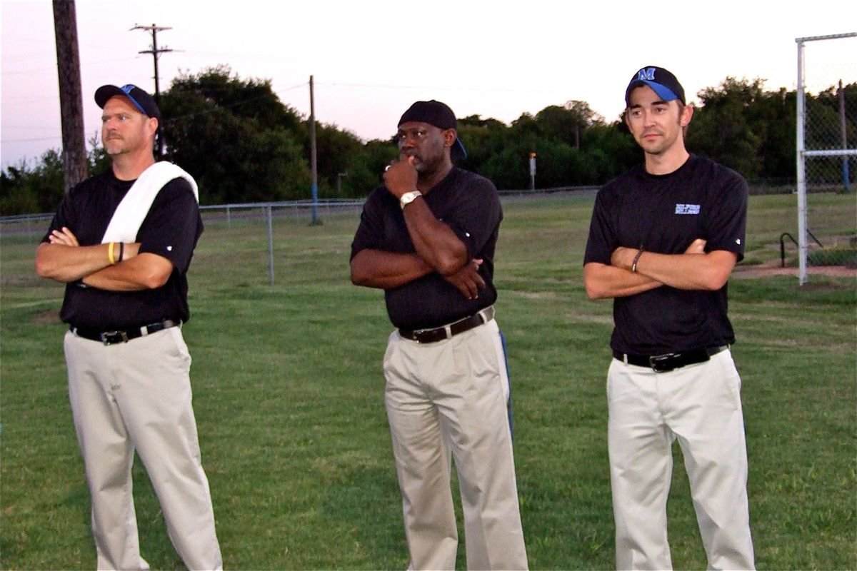 Image: On the outside — Milford Bulldog coaches Ronny Crumpton, Otis Carter and Caleb Cox remain calm, on the outside, moments before taking the field.