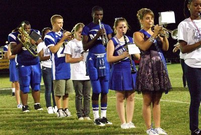 Image: Let’s all play! — The MHS Band relies on football players and cheerleaders to help put on the halftime show.