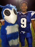 Image: No hard feelings — Although, the 52-6 loss to Milford still stings a bit if your a Hornet fan. The Walnut Springs mascot and Milford’s Dez Buckaloo honor the spirit of 6-man football.