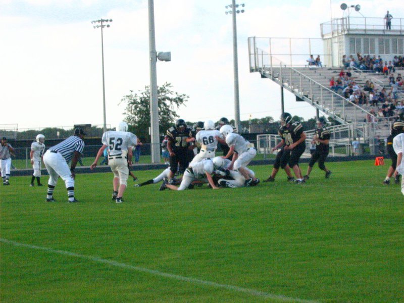 Image: Swarming defense — Italy 7th grade wins scrimmage 14-0, 8th grade loses 28-0 and JV ties 20-20.