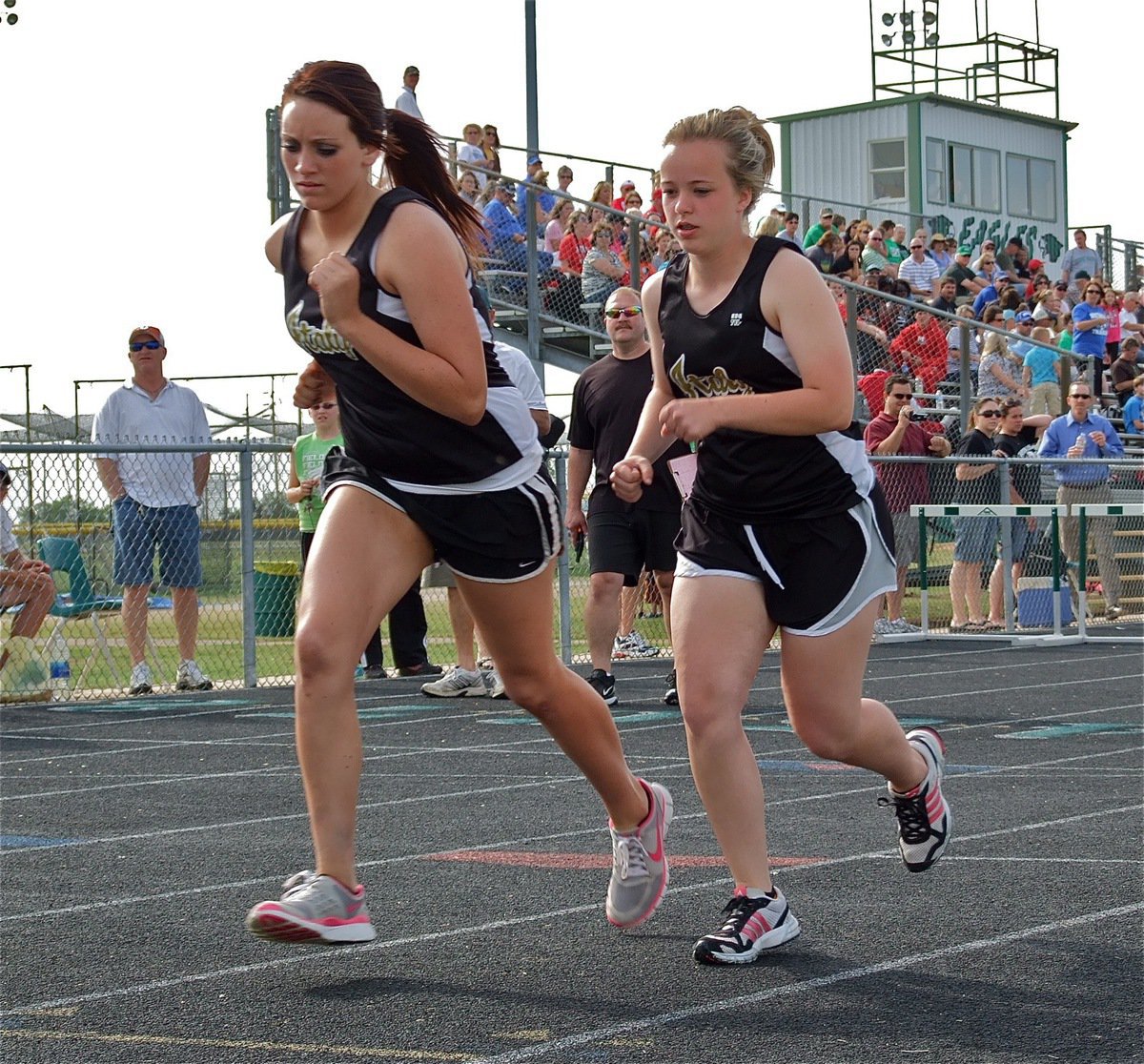 Image: Working together — Breyanna Beets finishes in 1st place and teammate, Felicia Little, finishes in 6th place during the 800 meter run.