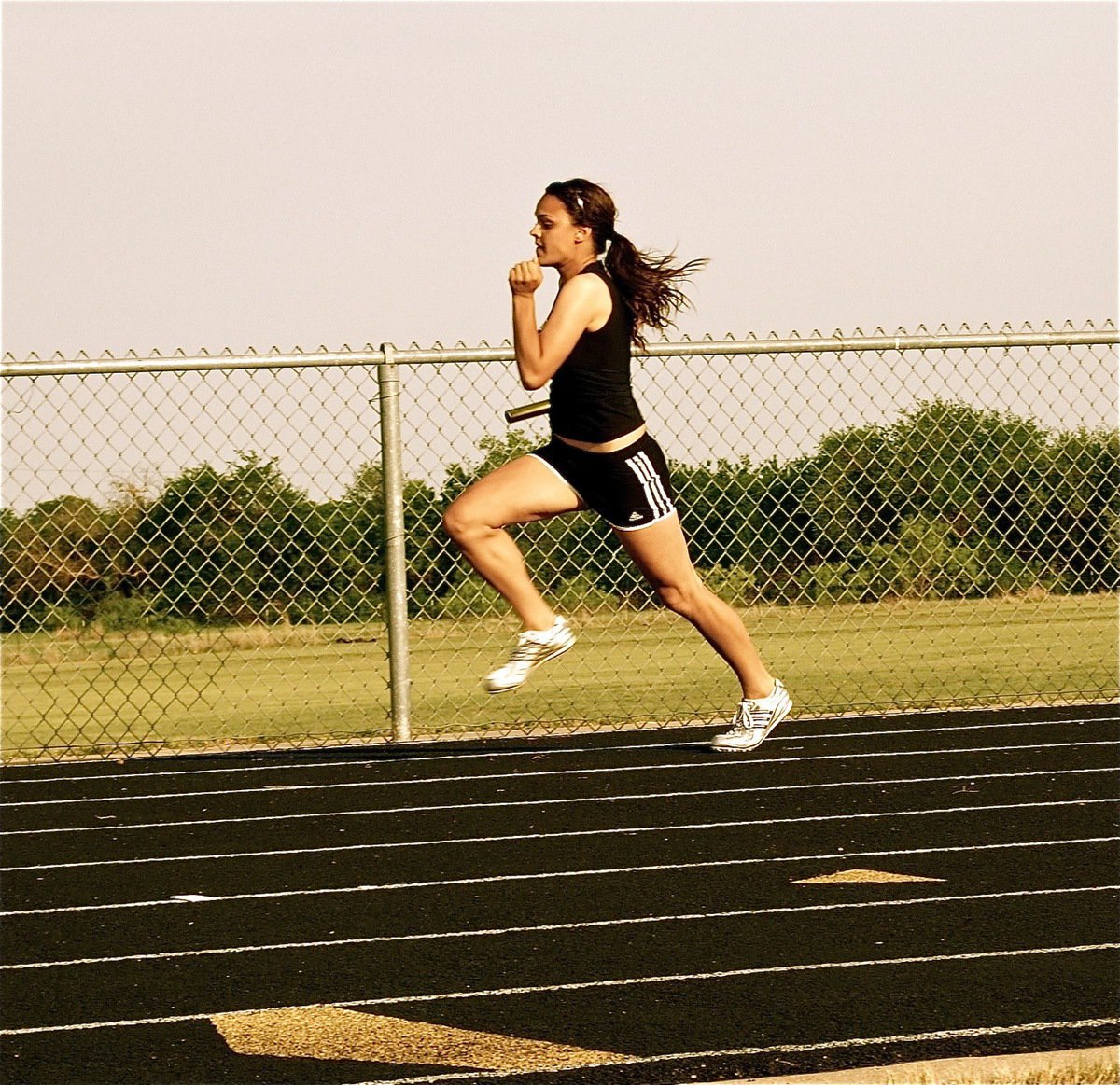 Image: Anna’s on the run — Anna Viers runs the first leg of the Italy JV girls 400 meter relay team.