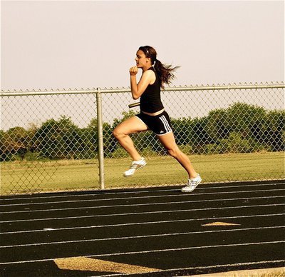 Image: Anna’s on the run — Anna Viers runs the first leg of the Italy JV girls 400 meter relay team.