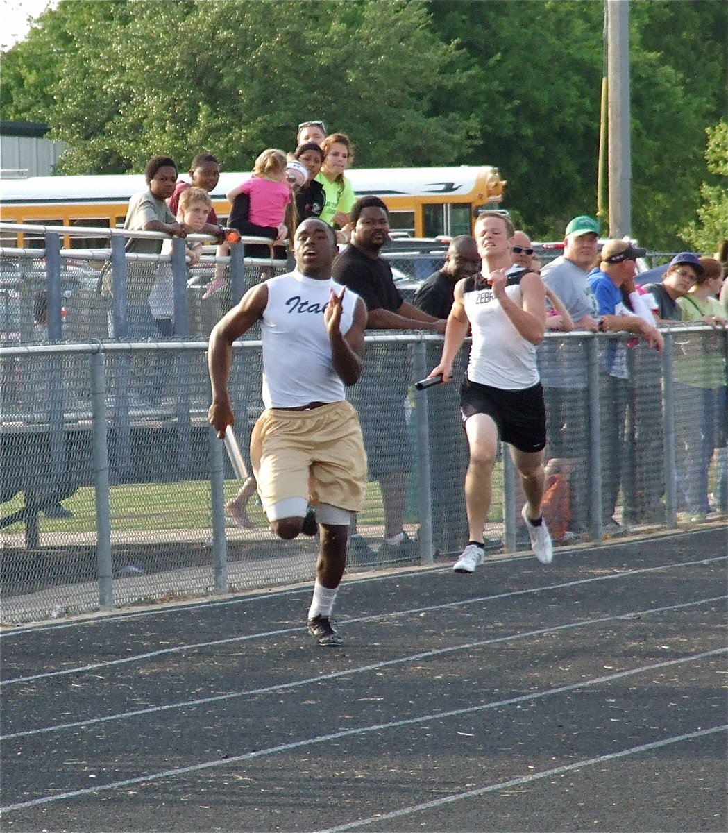 Image: Almost there — Jasenio Anderson runs the final leg for the Italy Varsity boys’ 400 meter relay.