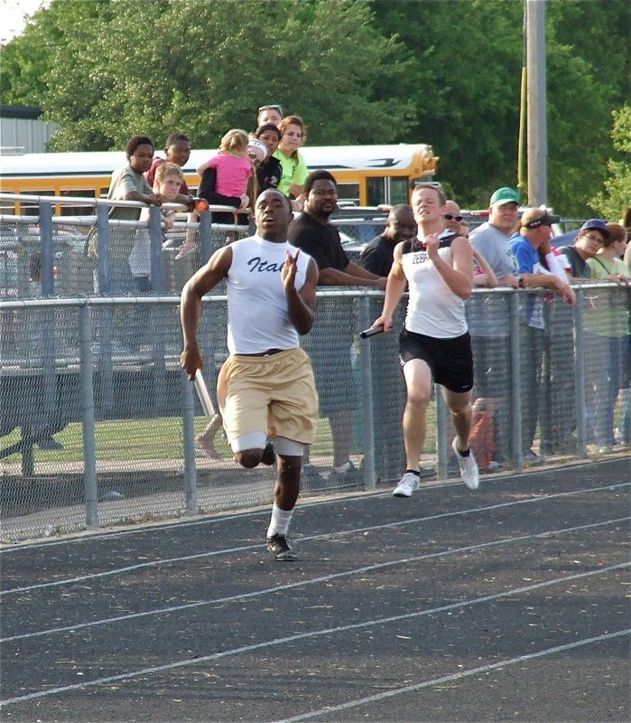 Image: Almost there — Jasenio Anderson runs the final leg for the Italy Varsity boys’ 400 meter relay.