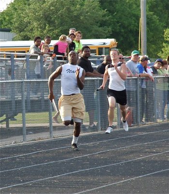 Image: Almost there — Jasenio Anderson runs the final leg for the Italy Varsity boys’ 400 meter relay.