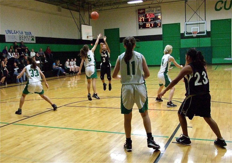 Image: 3 shoots a three — Ryisha Copeland(3) shoots a three-pointer over a Clifton defender during the JV Girls game.
