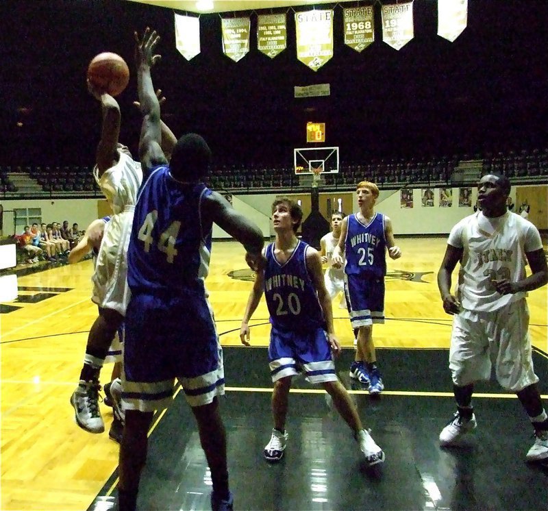 Image: Lewis leaps high — Italy’s Jamal Jalarnce Lewis(20) leaps high for a basket over Whitney’s defense during the JV Boys game while teammate T.J. Cockran(33) gets ready to rebound.