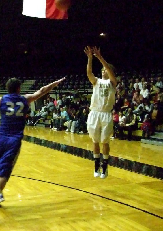 Image: Brandon from deep — Gladiator Brandon Souder(15) attempts a jump shot during fourth-quarter action.