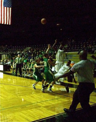 Image: Teaming up — Gladiator seniors Heath Clemons(2) and Jasenio Anderson(11) combine forces to get the shot away.