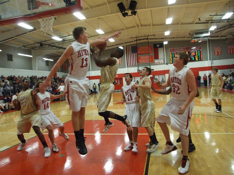 Image: The Gladiators glide past the Panthers 68-62 — Italy’s Jasenio Anderson(11) helps the Gladiators (17-5) move past the Maypearl Panthers and remain undefeated in district play at 5-0. Italy held off a late comeback by the Panthers to win 68-62 in Maypearl.
