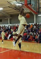 Image: Jam session — Devonta Simmons assists in getting the fans excited before the game with his aerial display of dunks.