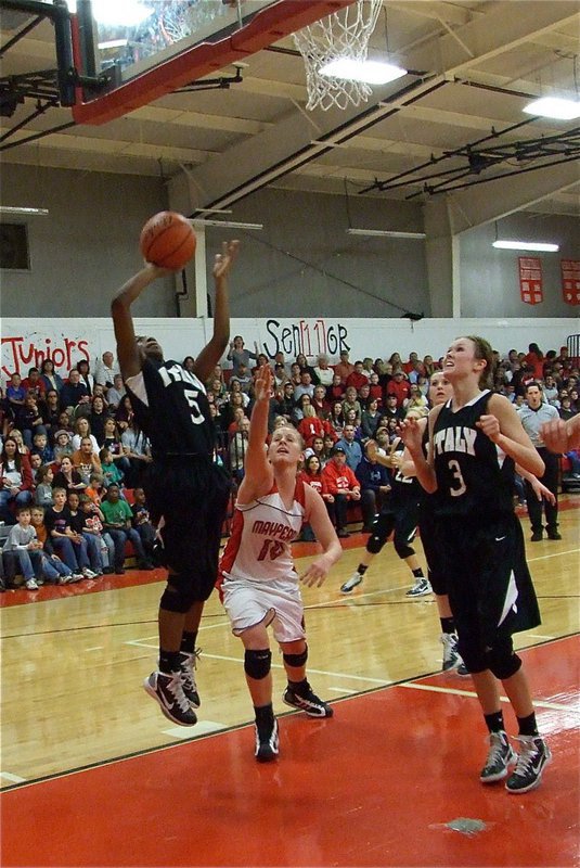 Image: Jameka scores — Italy’s Jameka Copeland(5) lays in a bucket with teammate Kaitlyn Rossa(3) ready to rebound.