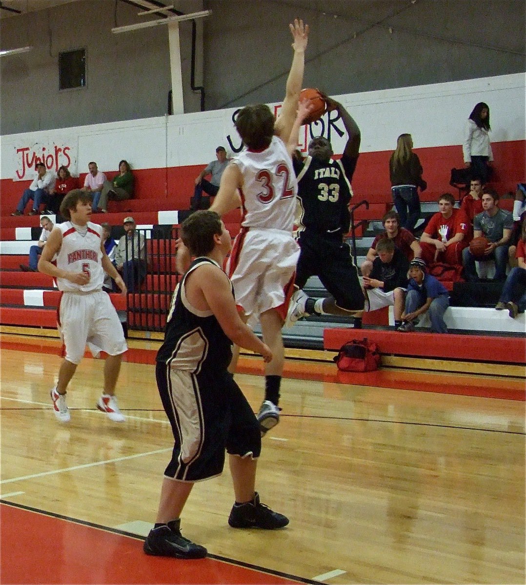 Image: Insane hops — T.J. Cockerham(33) rises for a jump shot against Maypearl during the JV boys matchup.