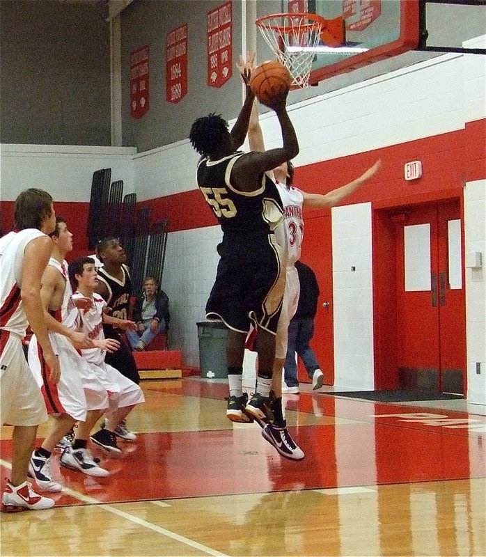 Image: Walker climbs — Italy’s Raheem Walker(55) is a very athletic post player.