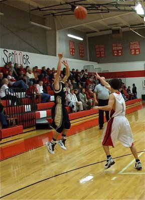 Image: Caden connects — Caden Jacinto(2) knocks down a three-pointer for the JV Gladiators.
